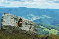 Heather Gregg’s 10-year-old son sits at the top of Spruce Knob, West Virginia’s highest peak.
